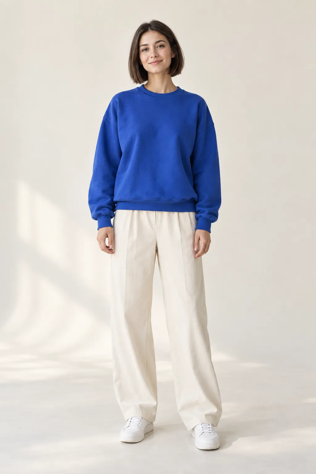 Example character photo: a woman in a blue sweatshirt standing in front of the camera